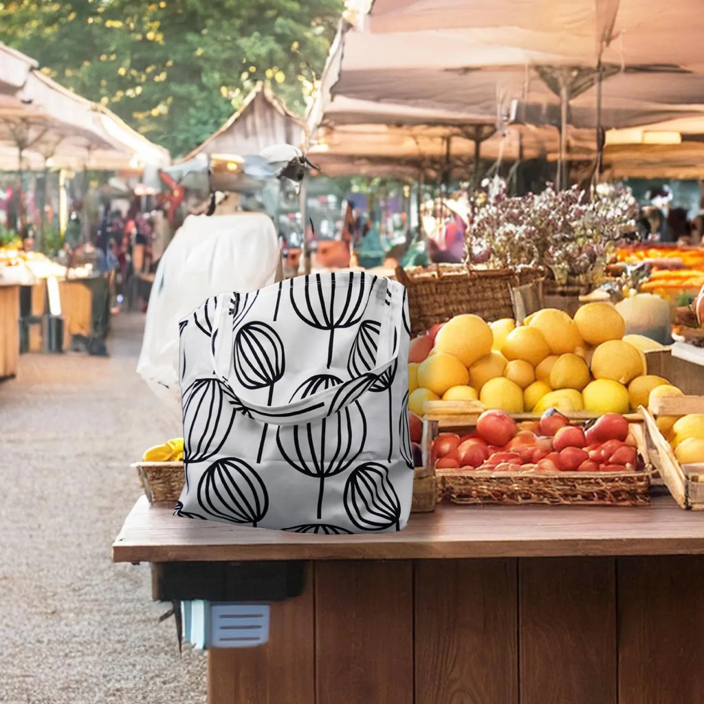 tote bag sitting on a farmers market stand counter